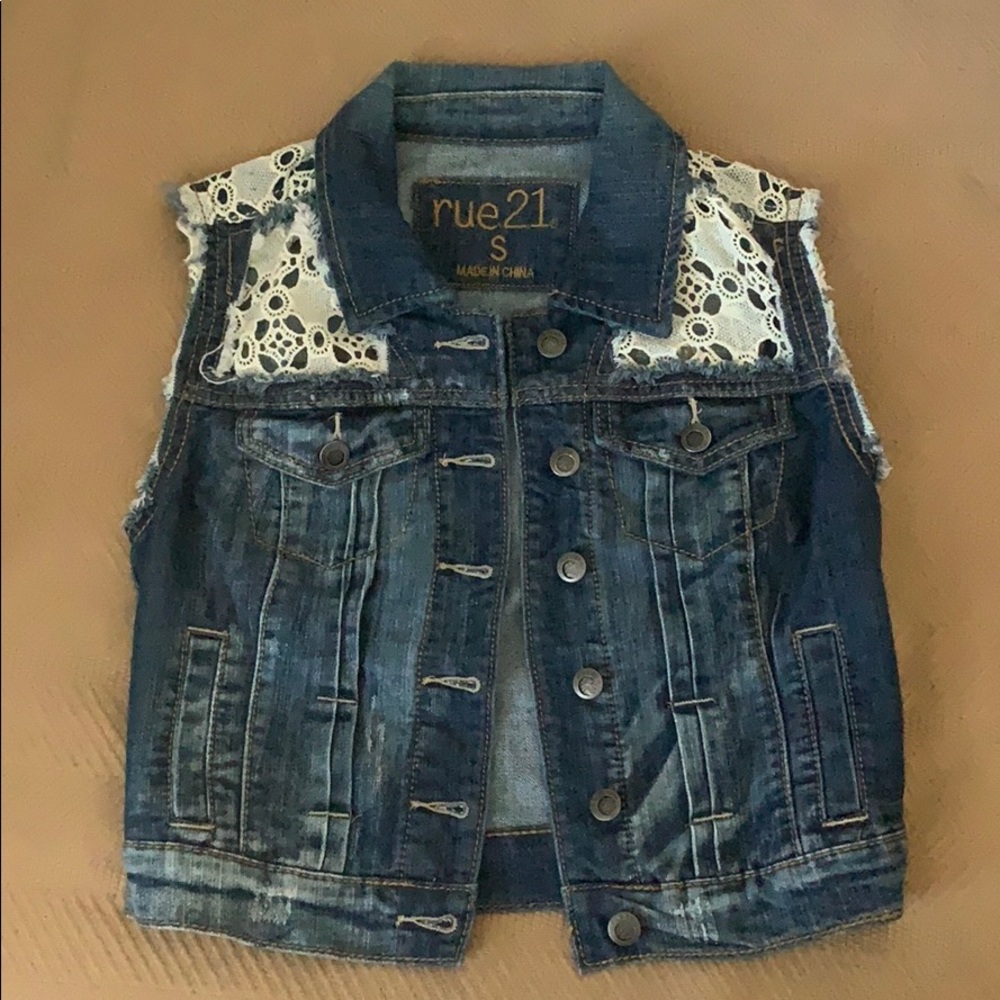 Sleeveless denim jacket with white lace detailing
